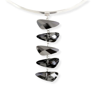 Swarovski wing shaped crystal necklace in a dark reflective grey color. The five crystal pendant is displayed on a removeable and exchangeable silver plated brass torque neck wire.