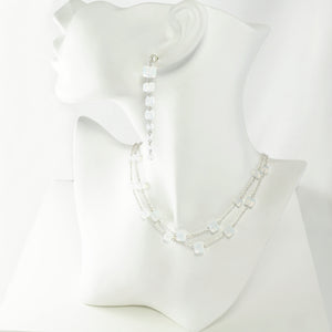 Lightweight earrings and necklace set consisting of sterling silver and Swarovski cube crystals in a milky, white opal color.