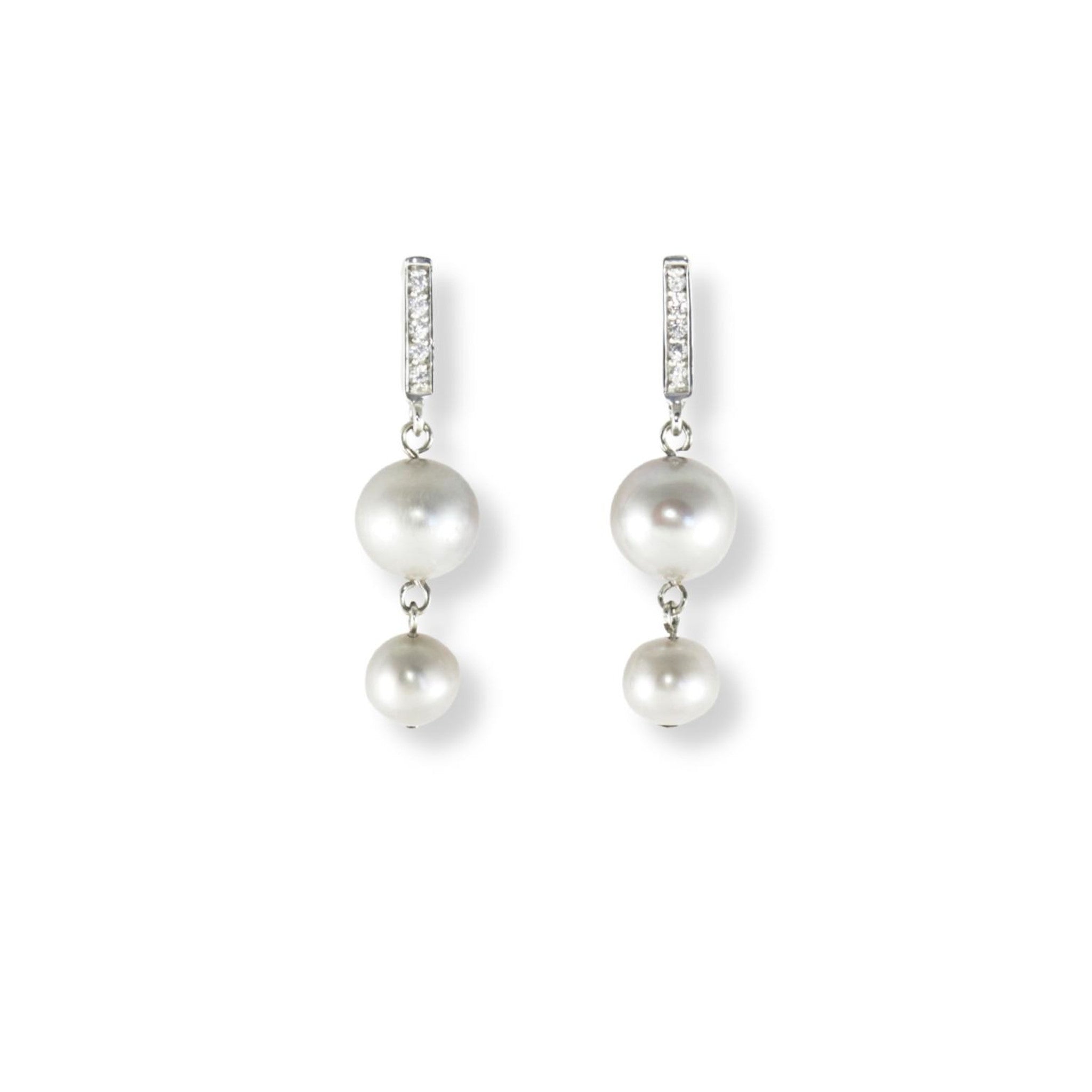 Cubic zirconia and sterling silver dangle earrings accompanied by two classic grey freshwater pearls per earring.