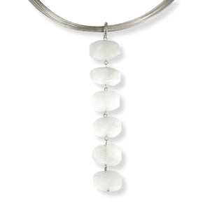 Displayed on an interchangeable sterling silver neck wire hangs a six crystal pendant made from authentic white moonstone. 