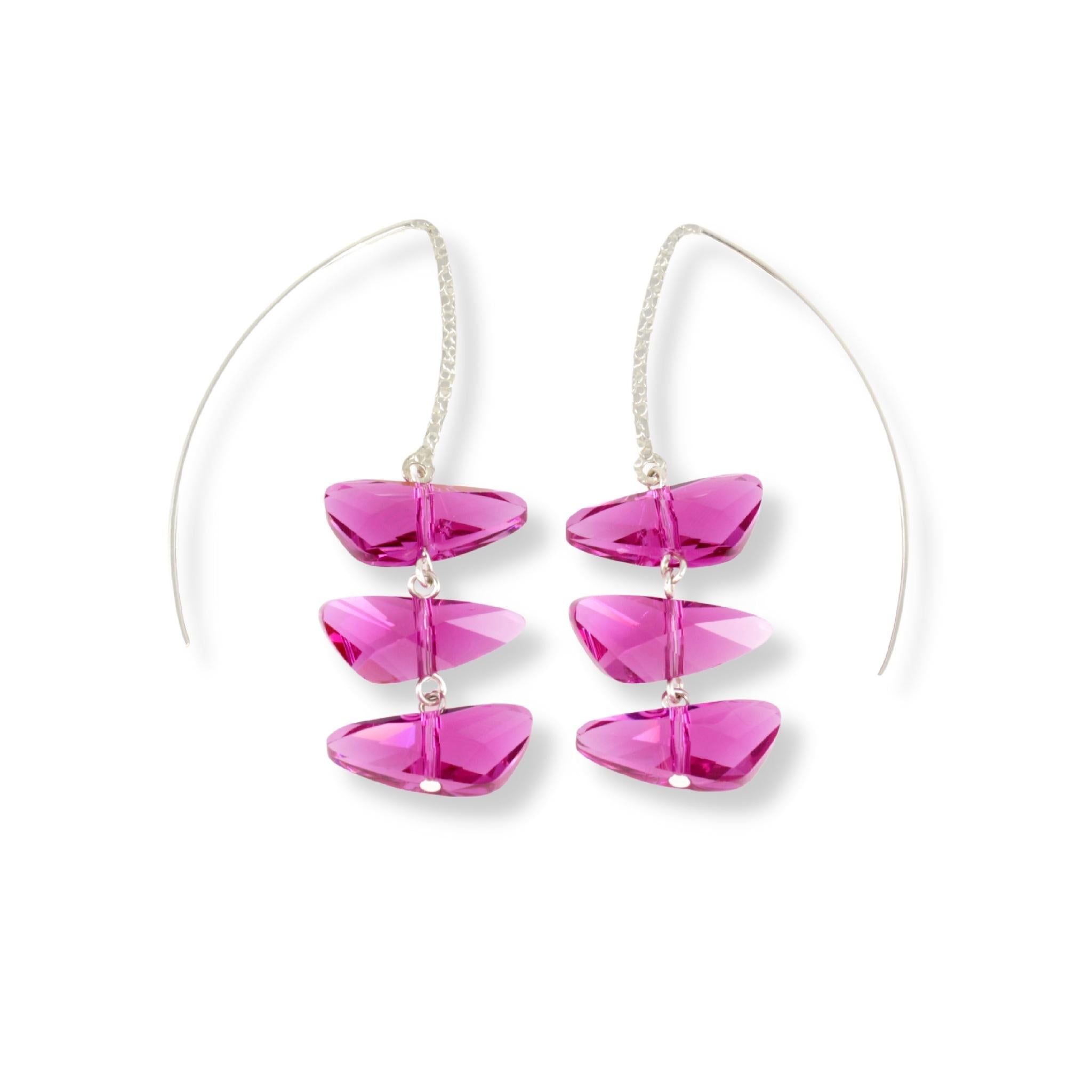 Sterling silver long marquise hook style earrings featuring three wing shaped Swarovski crystals in a reflective, light fuchsia color.