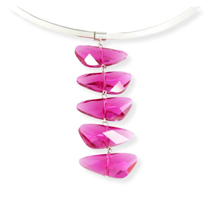 Wing shaped Swarovski crystal pendant necklace in a reflective fuchsia color. The five crystal pendant is displayed on an interchangeable silver plated brass torque neck wire . 