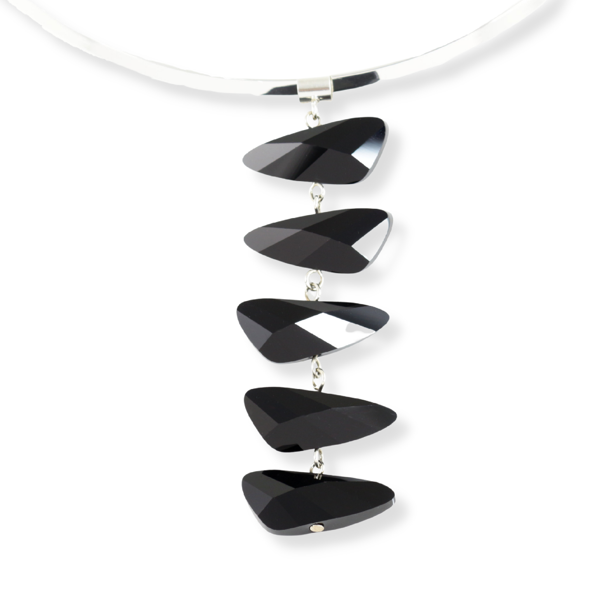 Wing shaped Swarovski crystal pendant necklace in a reflective jet black color. The five crystal pendant hangs on a removeable and interchangeable silver plated brass torque neck wire.
