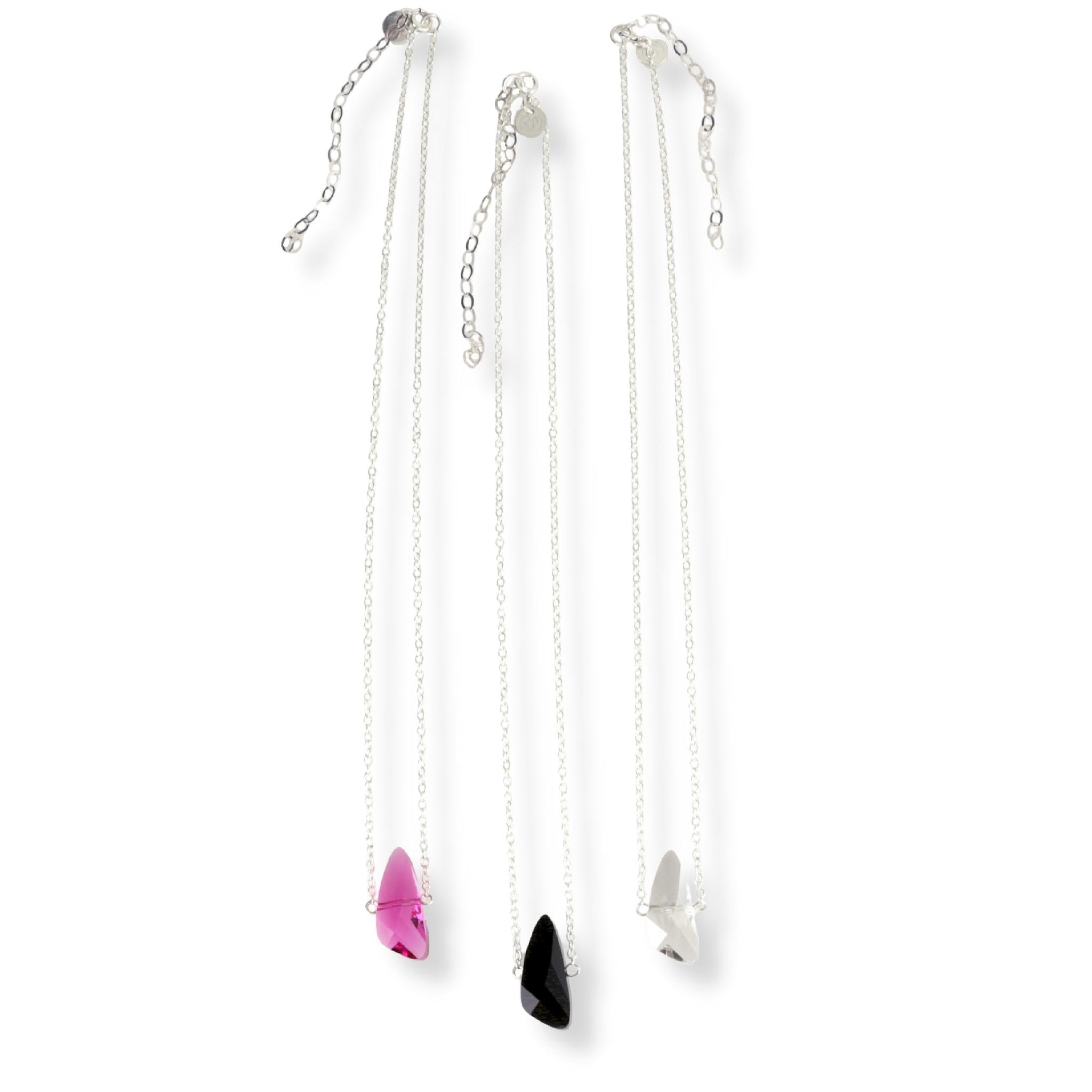 Single Swarovski crystal reflective pendant necklaces on a sterling silver chain. Crystal pendants come in either fuchsia, jet black, or silver shade (clear) color