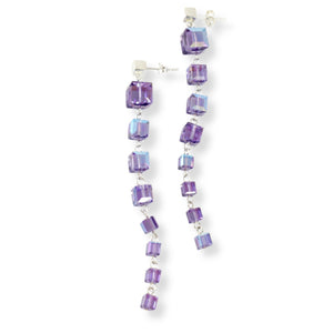 Earrings made from iridescent and sparkly blueish purple Swarovski cube shaped tanzanite crystals pieced together with sterling silver. 