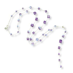 Long, versatile necklace made with sterling silver and iridescent tanzanite purple Swarovski cubed crystals.  Chain and clasps are sterling silver.